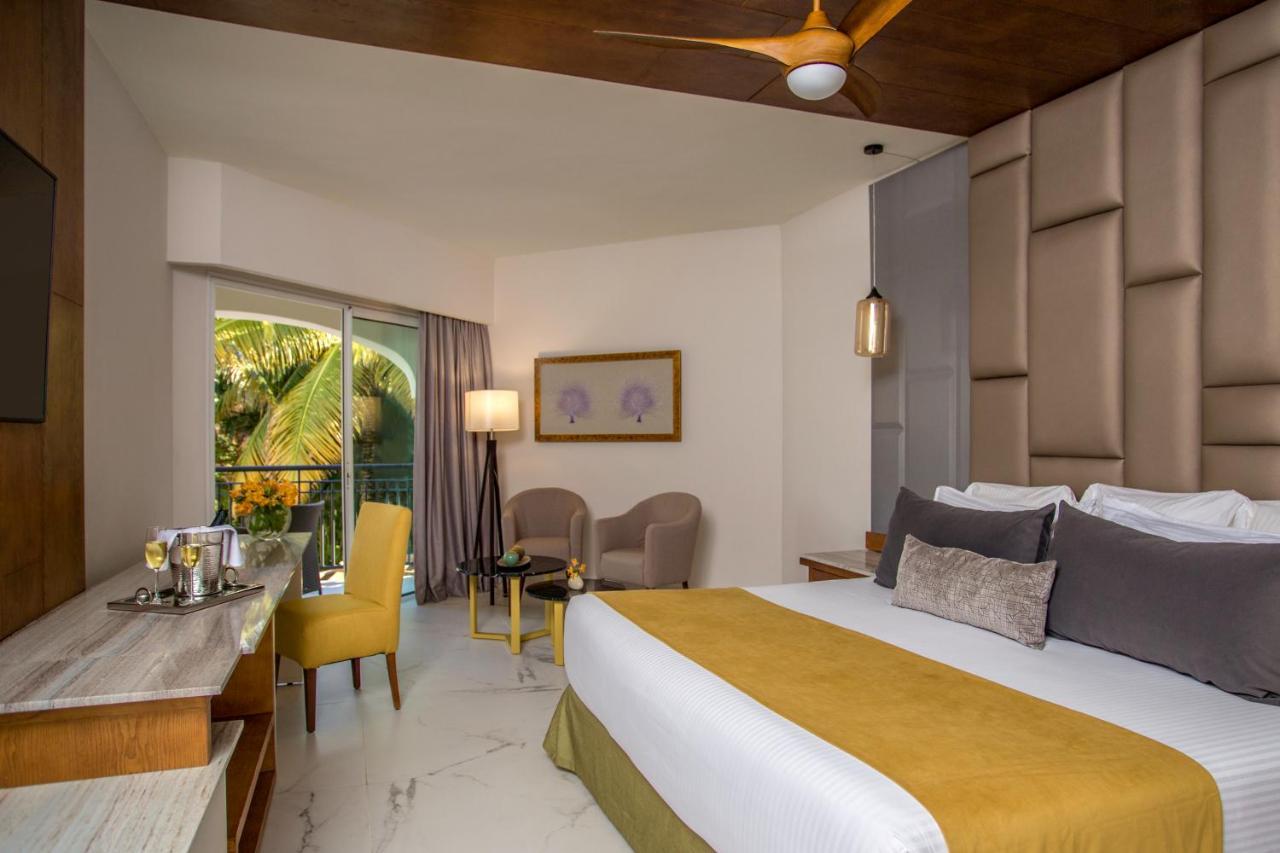 Preferred Club Junior Suite mit Kingsize-Bett und tropischer Aussicht