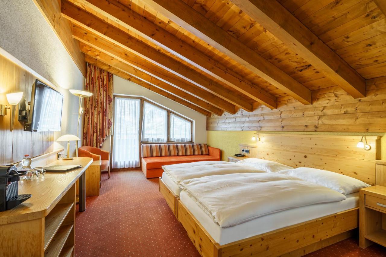 Deluxe Doppelzimmer mit Blick auf das Matterhorn und Balkon oder Terrasse im Erdgeschoss