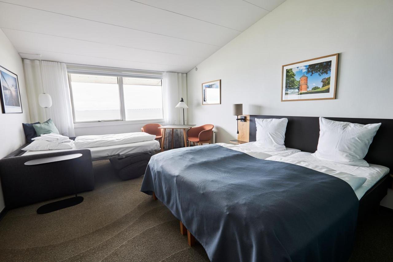 Dreibettzimmer mit Meerblick