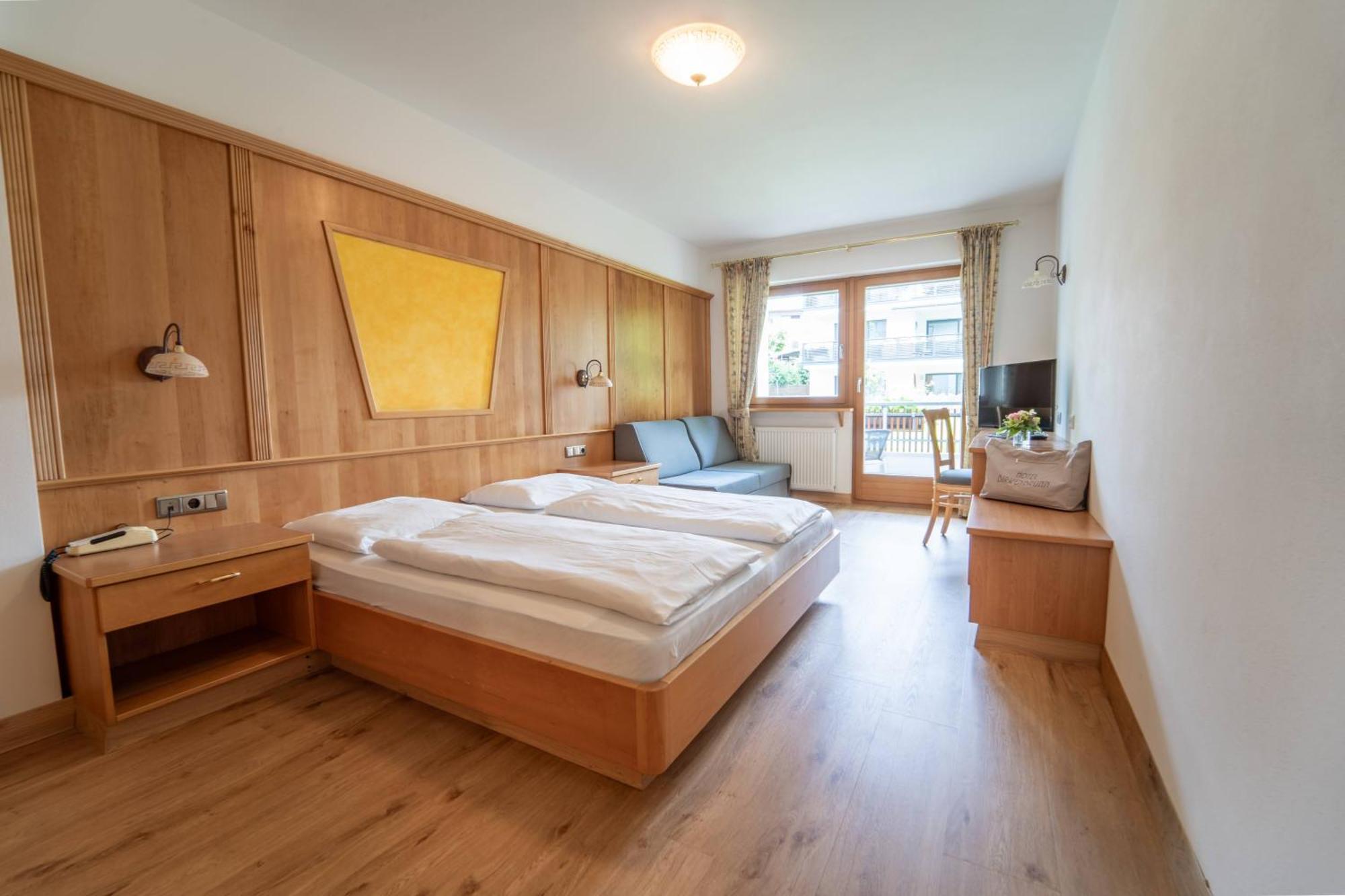 Dreibettzimmer mit Balkon