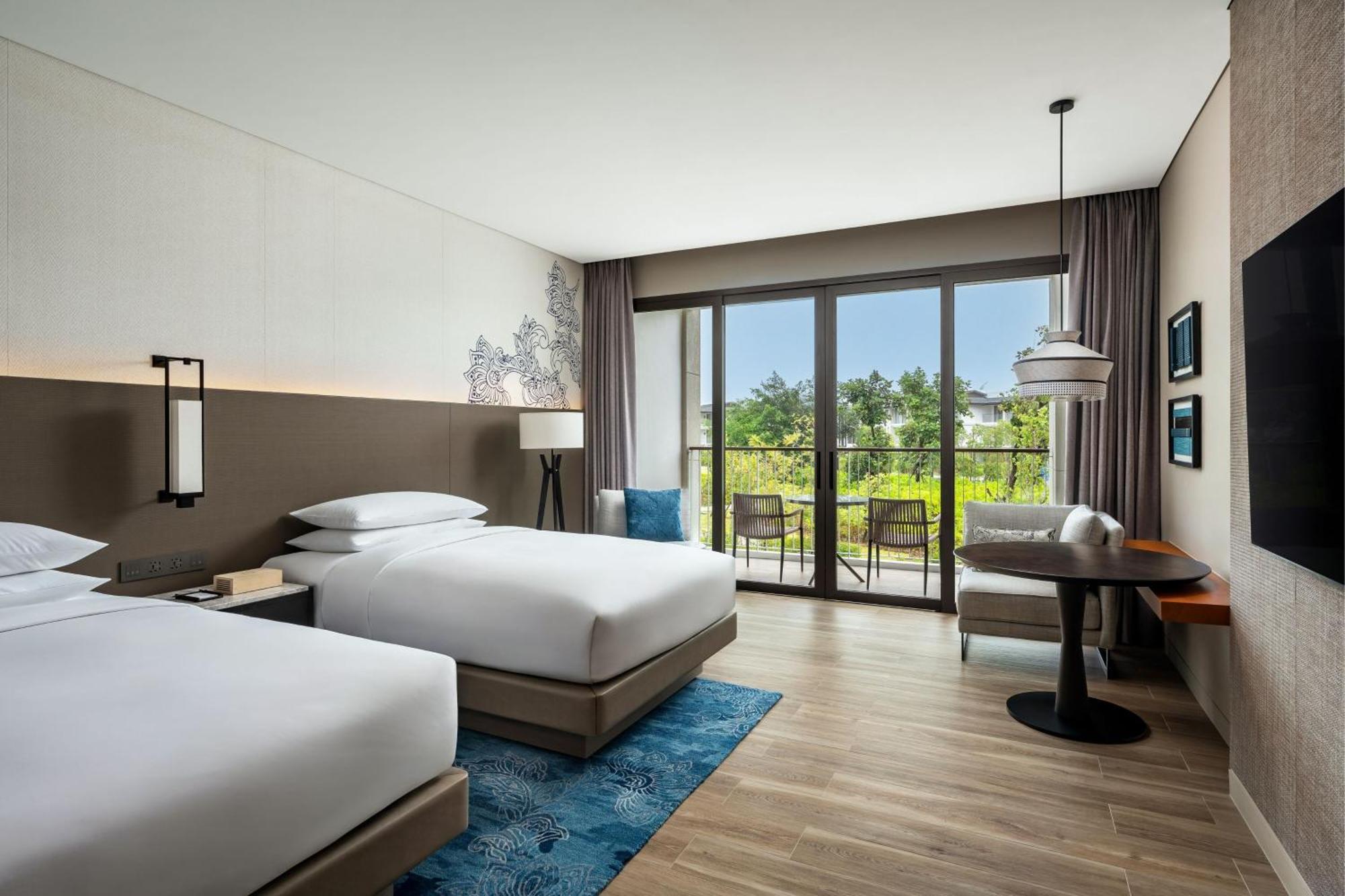 Deluxe Zweibettzimmer mit Balkon und Gartenblick