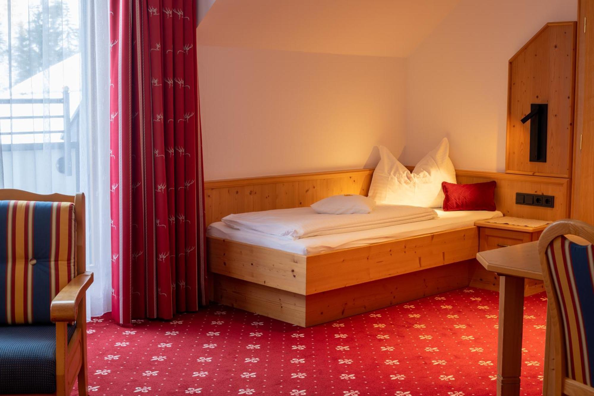 Dreibettzimmer mit Balkon