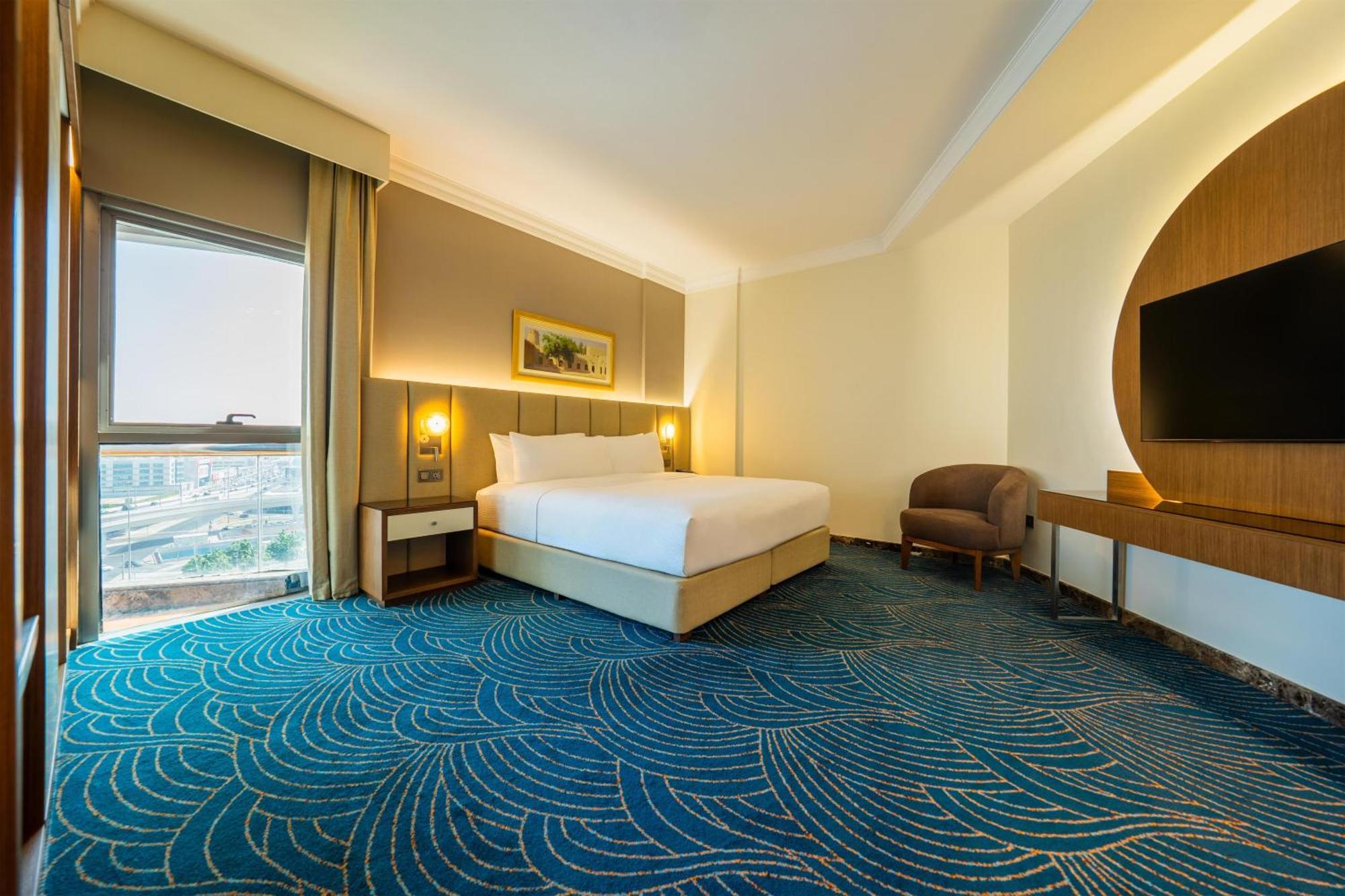 Suite mit 1 Schlafzimmer mit Kingsize-Bett und Balkon