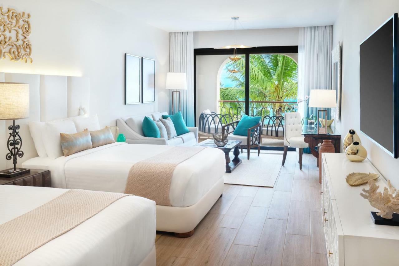 Luxuriöse Junior Suite mit 2 Queensize-Betten, Gartenblick und Balkon
